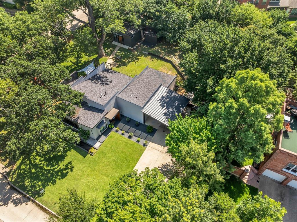 3449 West T Parr Road Grapevine, TX 76051 - Photo 2 of 32 an aerial view of a house with swimming pool and garden