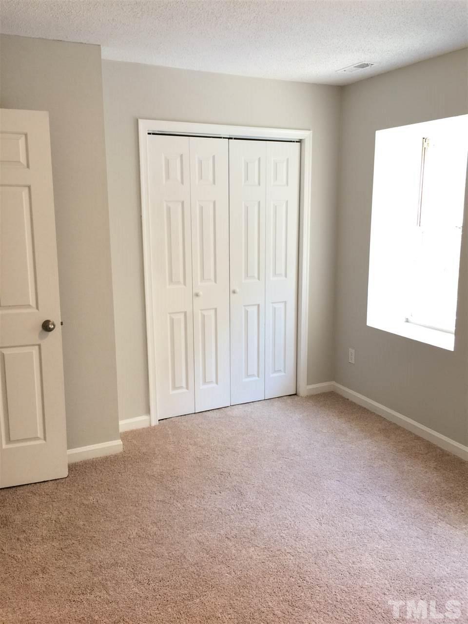 1507 Clermont Road, Unit T19 Durham, NC 27713 - Photo 8 of 17 an empty room with windows
