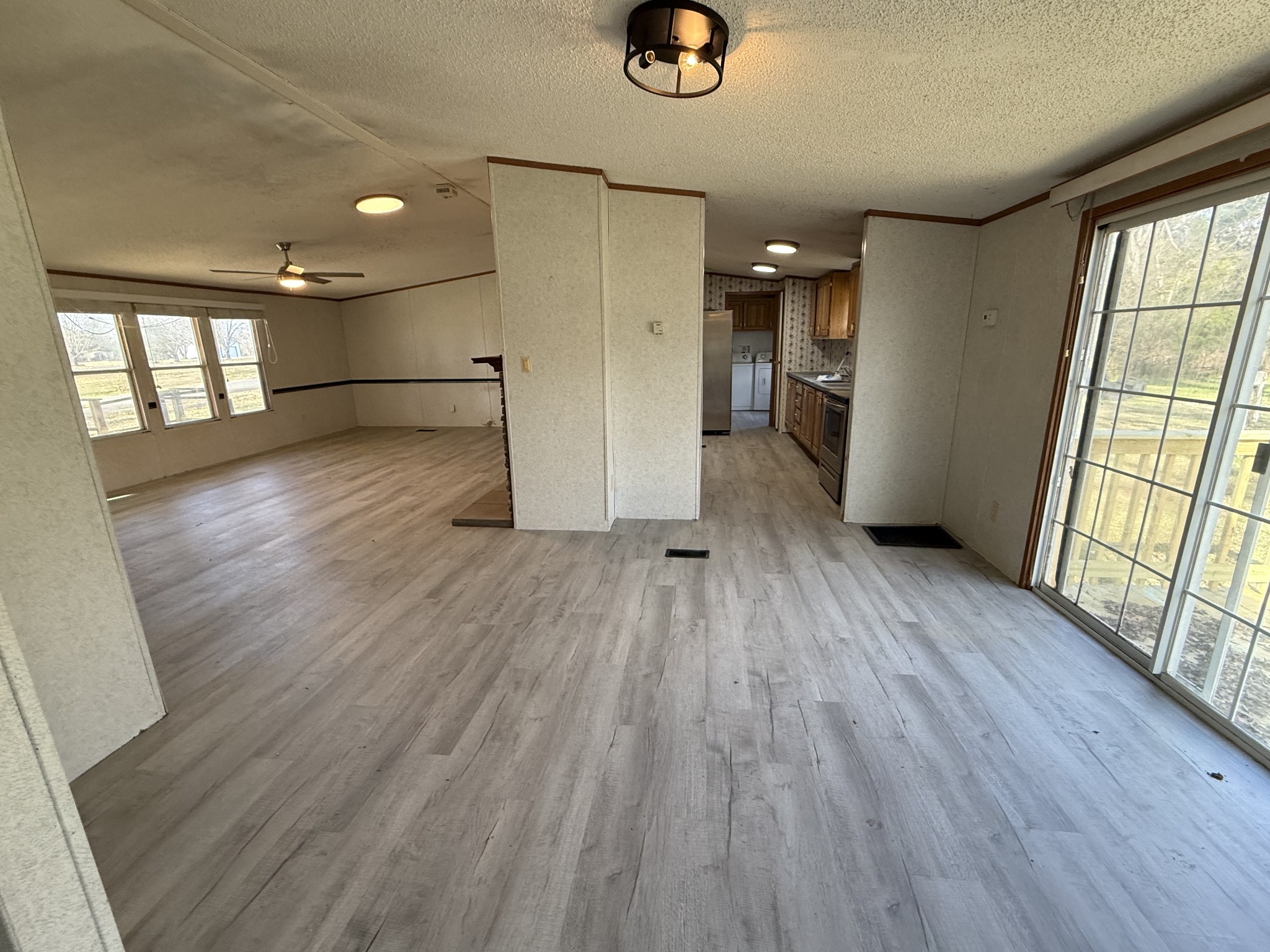 2421 Anes Station Road Lewisburg, TN 37091 - Photo 9 of 16 a view of empty room with wooden floor and windows
