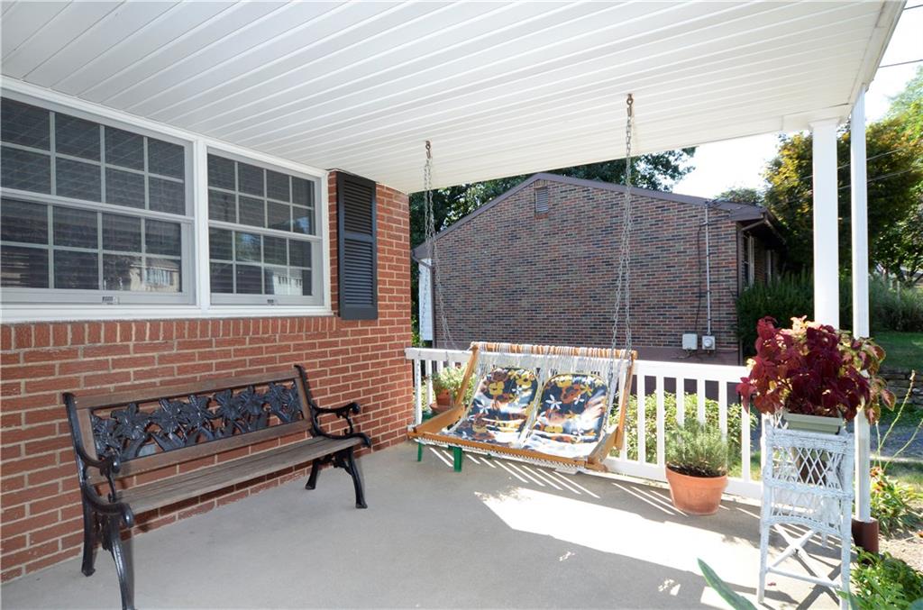 1033 Fiddleback Drive McKees Rocks, PA 15136 - Photo 3 of 20 Relax and swing on the front porch with family and friends