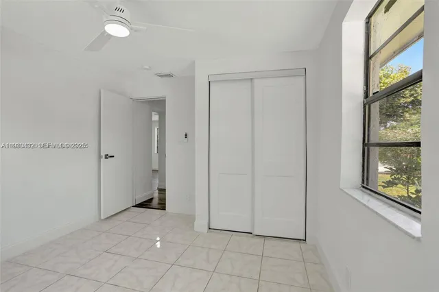 a bathroom with a toilet sink and vanity
