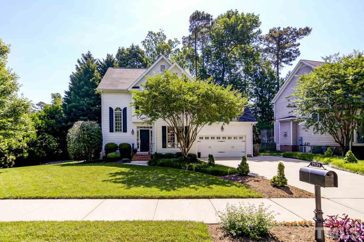 7934 Pine Timber Drive Raleigh, NC 27613 - Photo 1 of 22 a front view of a house with a yard