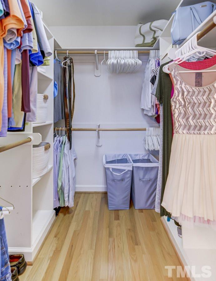 7934 Pine Timber Drive Raleigh, NC 27613 - Photo 13 of 22 a view of walk in closet with clothes and shoes