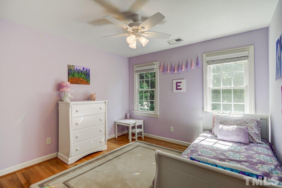 7934 Pine Timber Drive Raleigh, NC 27613 - Photo 14 of 22 a bedroom with a bed and a window