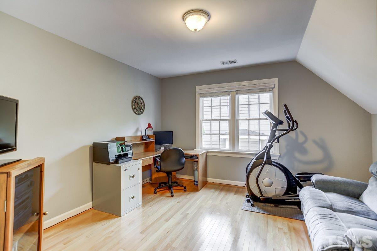 7934 Pine Timber Drive Raleigh, NC 27613 - Photo 16 of 22 a view of a livingroom with workspace and a window