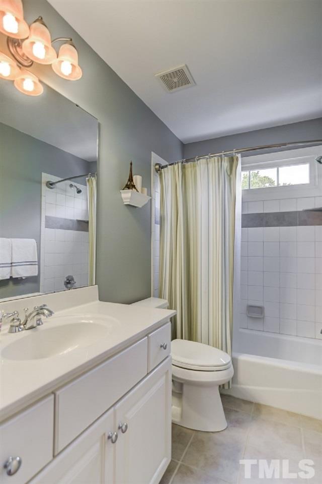 7934 Pine Timber Drive Raleigh, NC 27613 - Photo 17 of 22 a bathroom with a sink a toilet and shower
