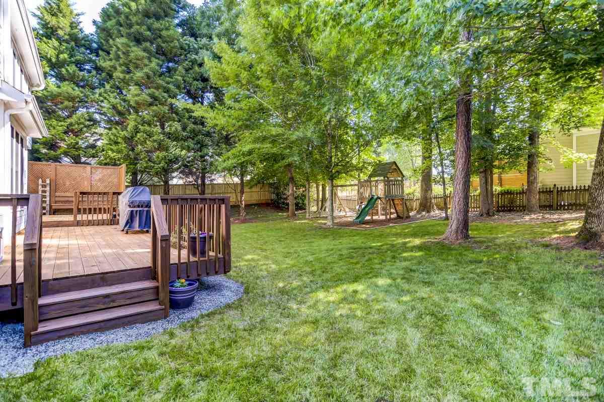 7934 Pine Timber Drive Raleigh, NC 27613 - Photo 20 of 22 a view of outdoor space with garden and trees