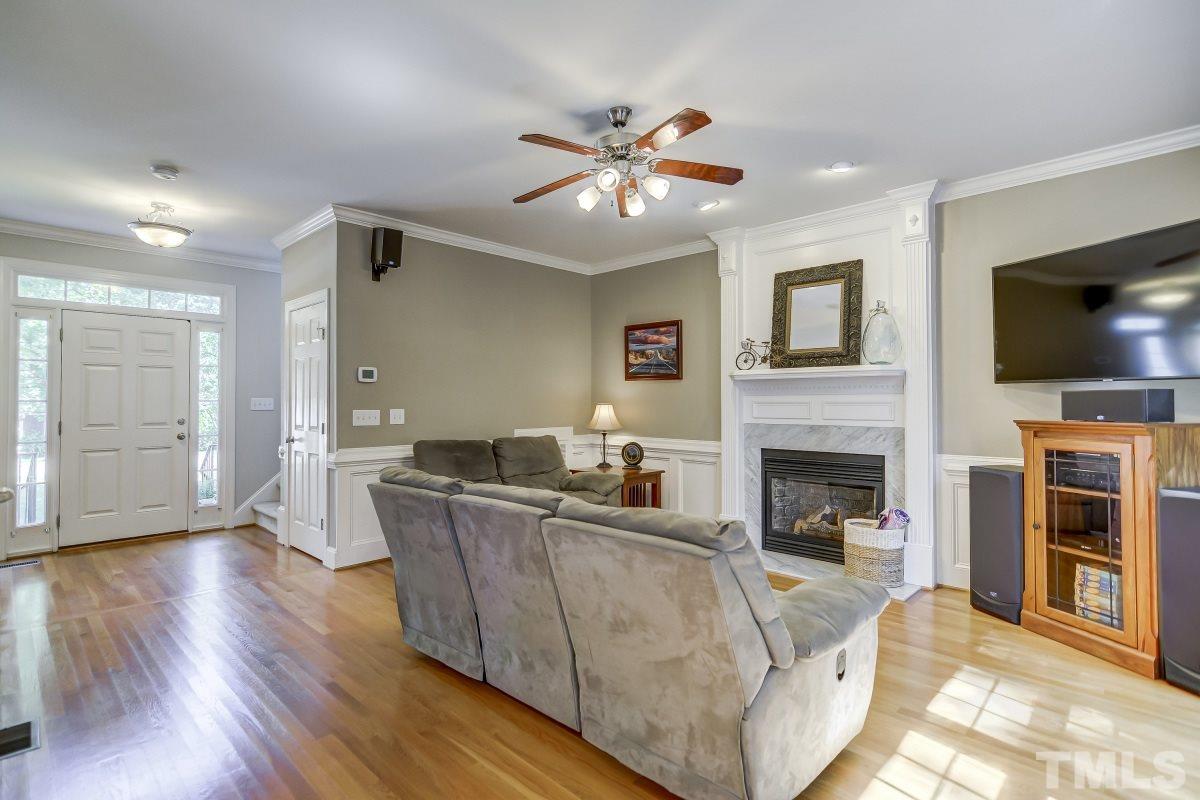 7934 Pine Timber Drive Raleigh, NC 27613 - Photo 3 of 22 a living room with furniture and a flat screen tv