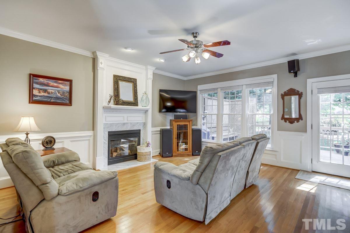7934 Pine Timber Drive Raleigh, NC 27613 - Photo 4 of 22 a living room with furniture and a fireplace