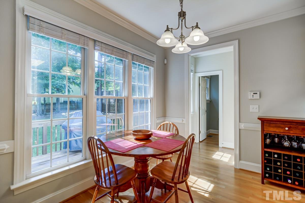 7934 Pine Timber Drive Raleigh, NC 27613 - Photo 9 of 22 a view of a dining room with furniture window and wooden floor
