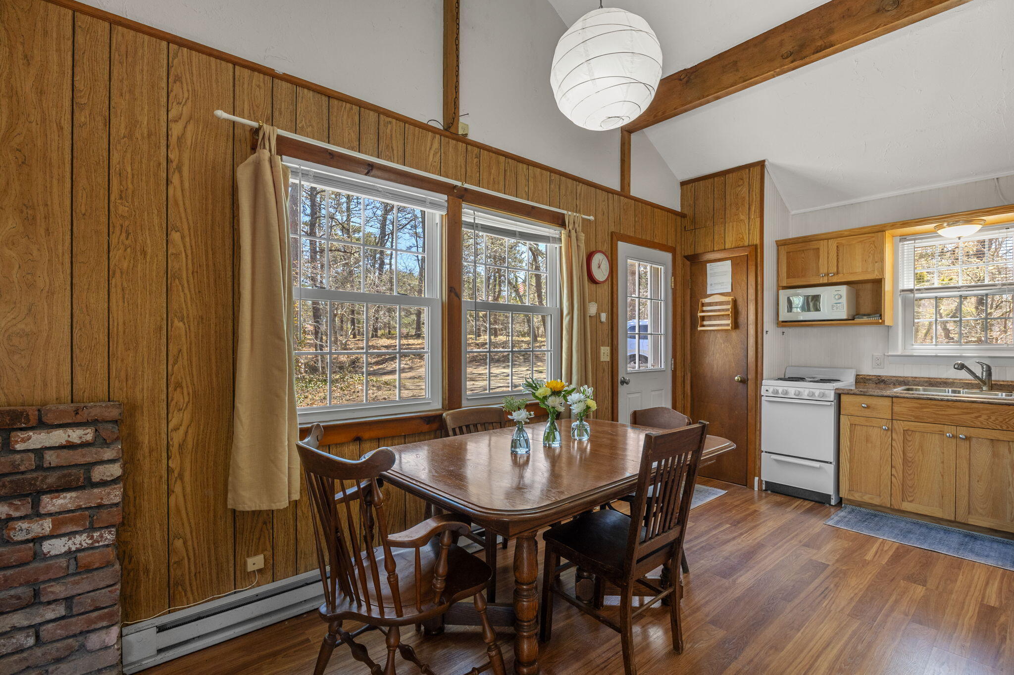 60 Long Avenue, Unit A Wellfleet, MA 02667 - Photo 8 of 28 a view of a dining room with furniture window and wooden floor