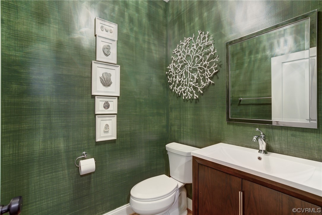 7097 Ware House Road Gloucester, VA 23061 - Photo 18 of 49 a bathroom with a toilet sink and mirror