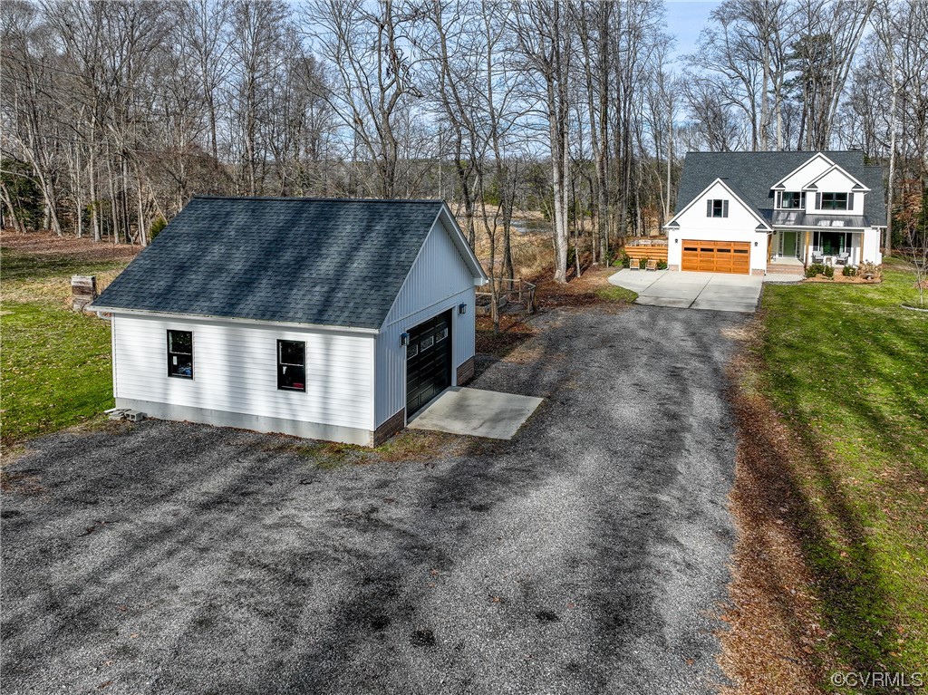 7097 Ware House Road Gloucester, VA 23061 - Photo 20 of 49 a front view of a house with large trees