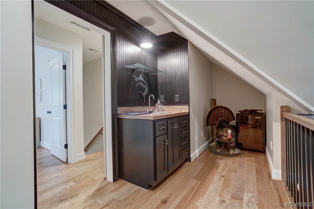 7097 Ware House Road Gloucester, VA 23061 - Photo 23 of 49 a en suite bathroom with a sink and mirror