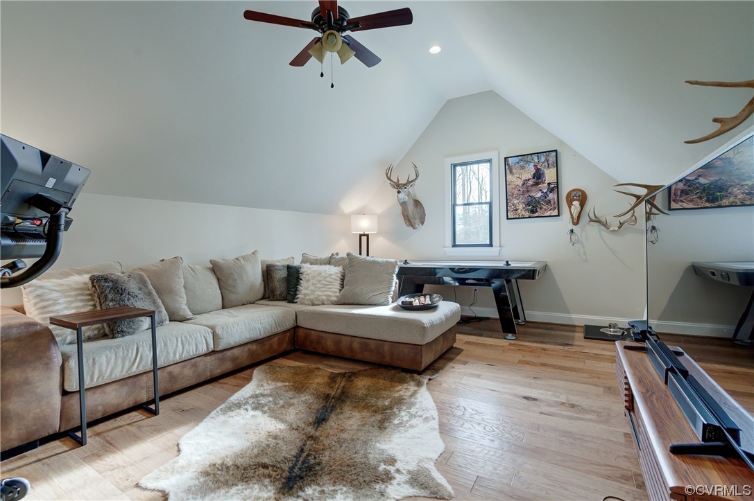 7097 Ware House Road Gloucester, VA 23061 - Photo 33 of 49 a living room with furniture and a flat screen tv