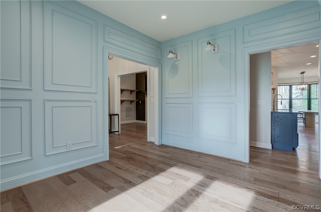 7097 Ware House Road Gloucester, VA 23061 - Photo 38 of 49 a view of a hallway with wooden floor and closet