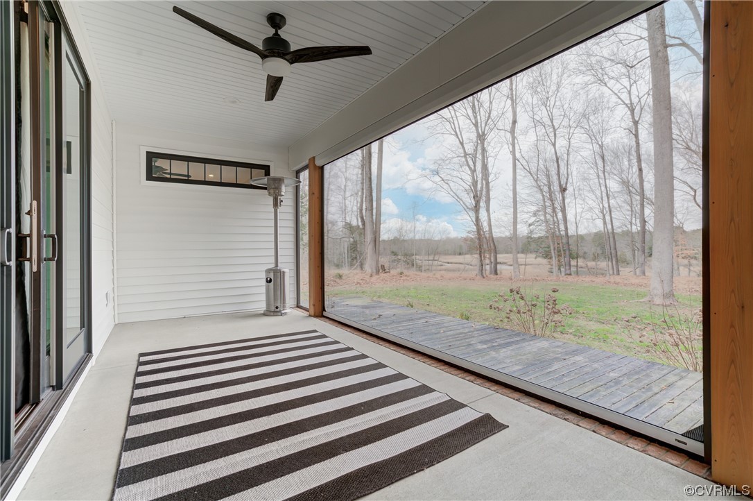 7097 Ware House Road Gloucester, VA 23061 - Photo 41 of 49 a bedroom with a bed and wooden floor