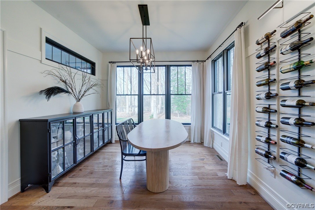 7097 Ware House Road Gloucester, VA 23061 - Photo 42 of 49 a view of a room with lots of furniture and wooden floor