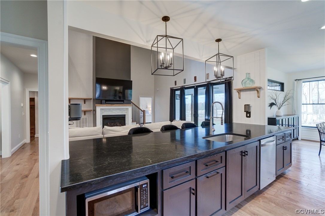 7097 Ware House Road Gloucester, VA 23061 - Photo 43 of 49 a kitchen with center island a sink appliances and a counter top space