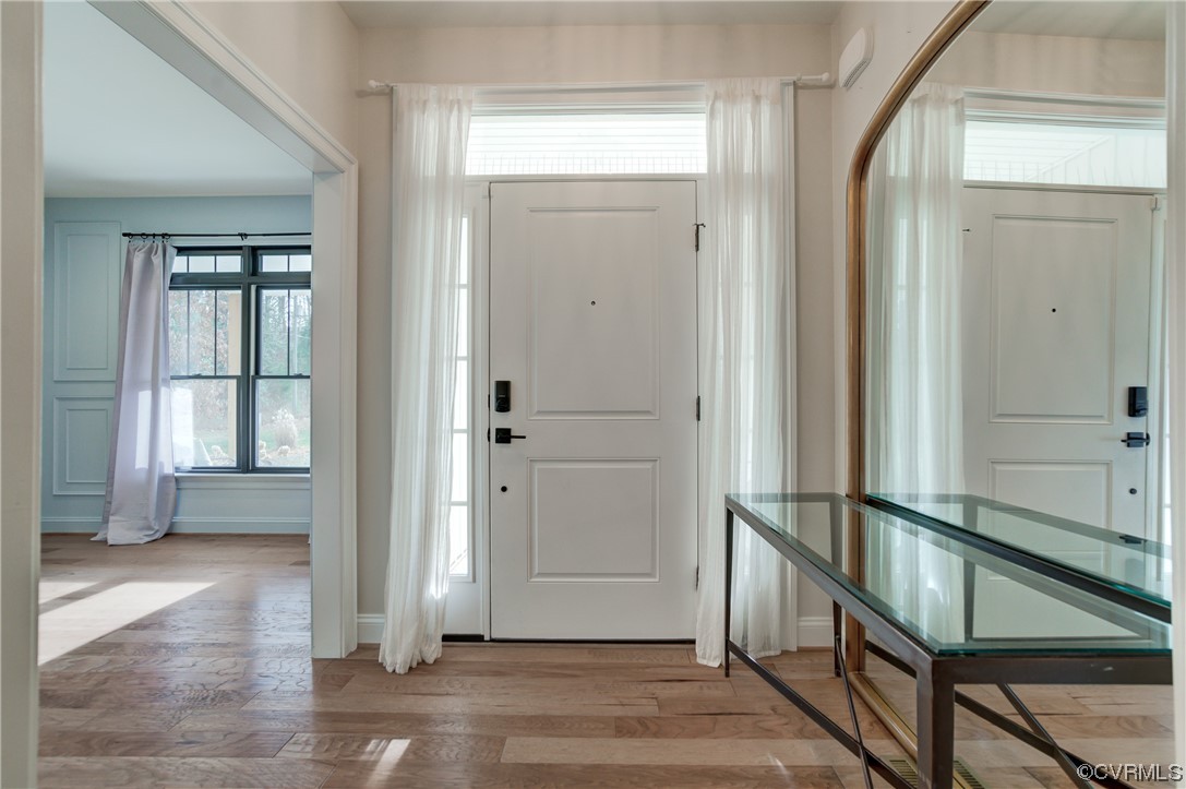 7097 Ware House Road Gloucester, VA 23061 - Photo 46 of 49 an entryway door with wooden floor and windows