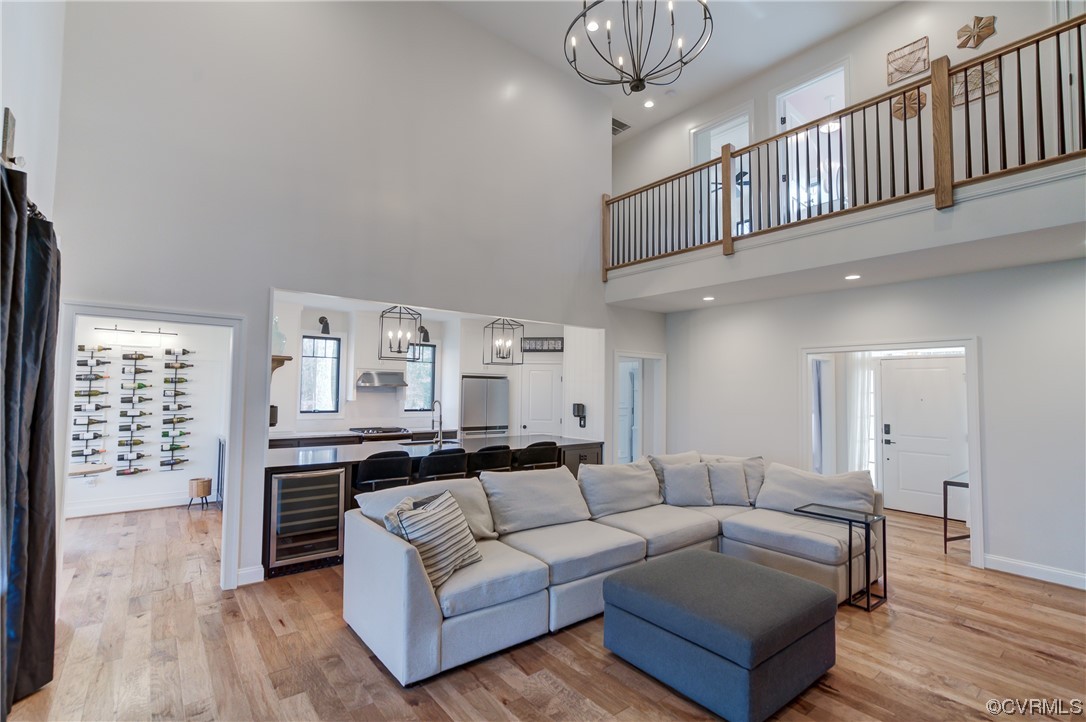 7097 Ware House Road Gloucester, VA 23061 - Photo 48 of 49 a living room with furniture a fireplace and wooden floor