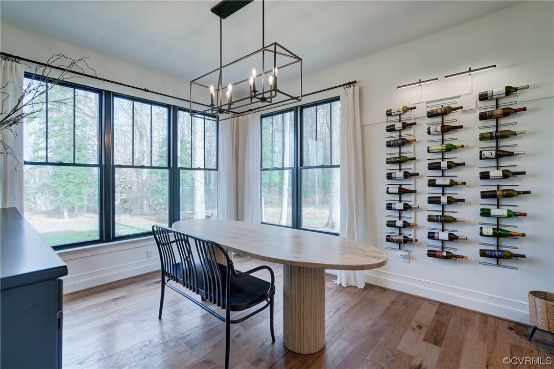 7097 Ware House Road Gloucester, VA 23061 - Photo 8 of 49 a view of a dining room with furniture window and wooden floor