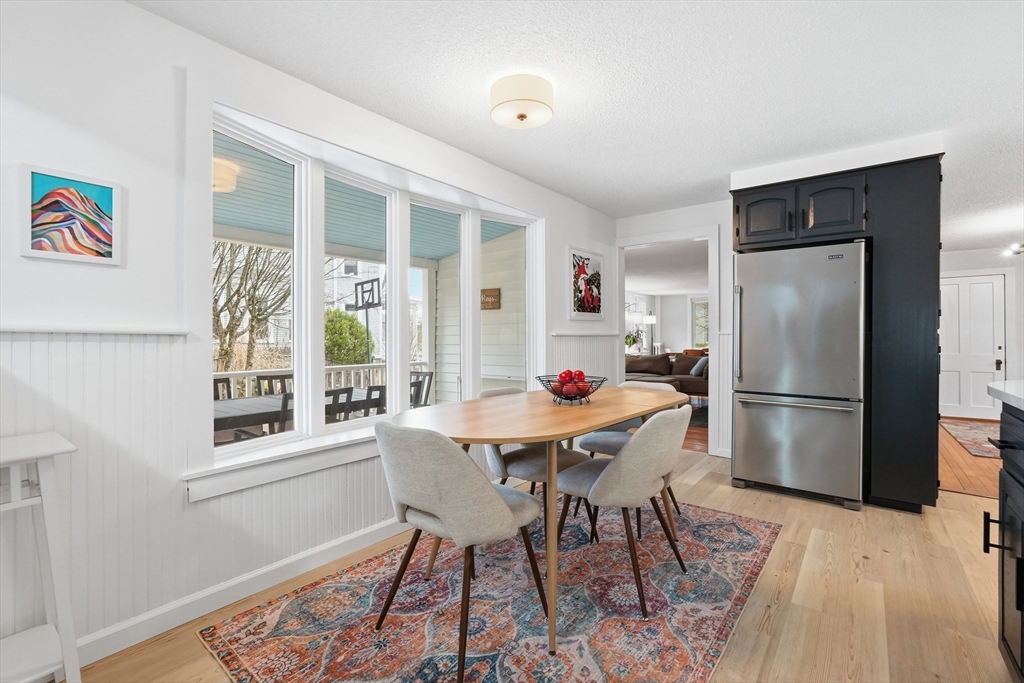 38 Front Street Northampton, MA 01053 - Photo 18 of 42 a kitchen with stainless steel appliances a dining table chairs and chandelier