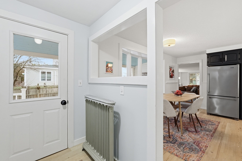 38 Front Street Northampton, MA 01053 - Photo 20 of 42 a room with furniture a refrigerator and a table