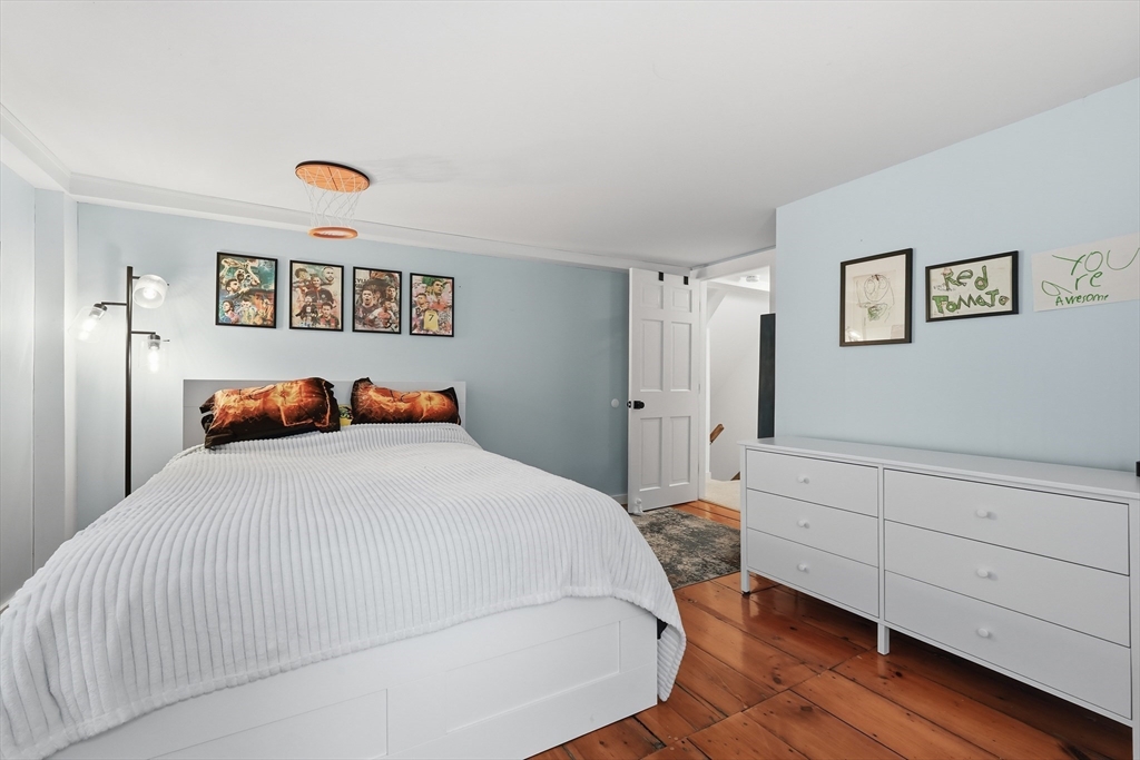 38 Front Street Northampton, MA 01053 - Photo 23 of 42 a bedroom with a bed and a painting on the wall