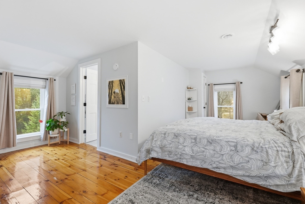 38 Front Street Northampton, MA 01053 - Photo 25 of 42 a bedroom with a large bed and wooden floor