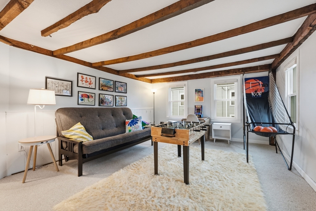 38 Front Street Northampton, MA 01053 - Photo 33 of 42 a living room with furniture and a rug