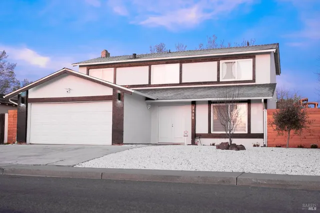 front view of a house with a street