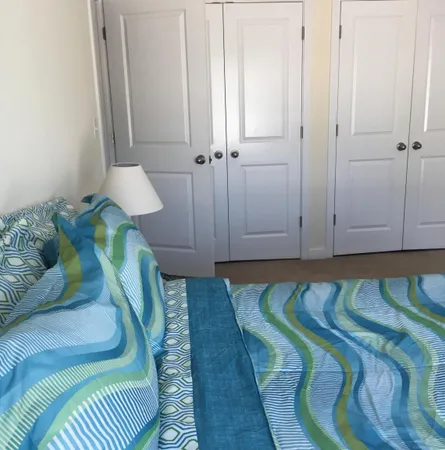 a room with a bed and a flat screen tv