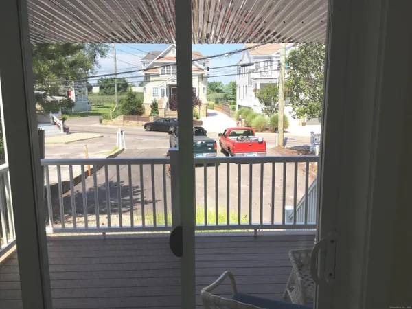 a dining room with furniture and a window