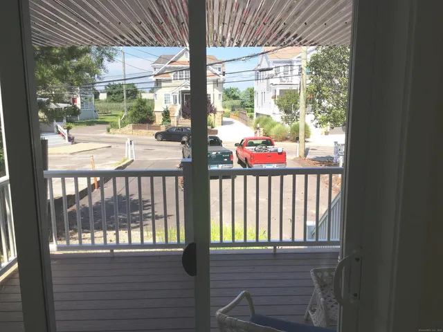 a dining room with furniture and a window