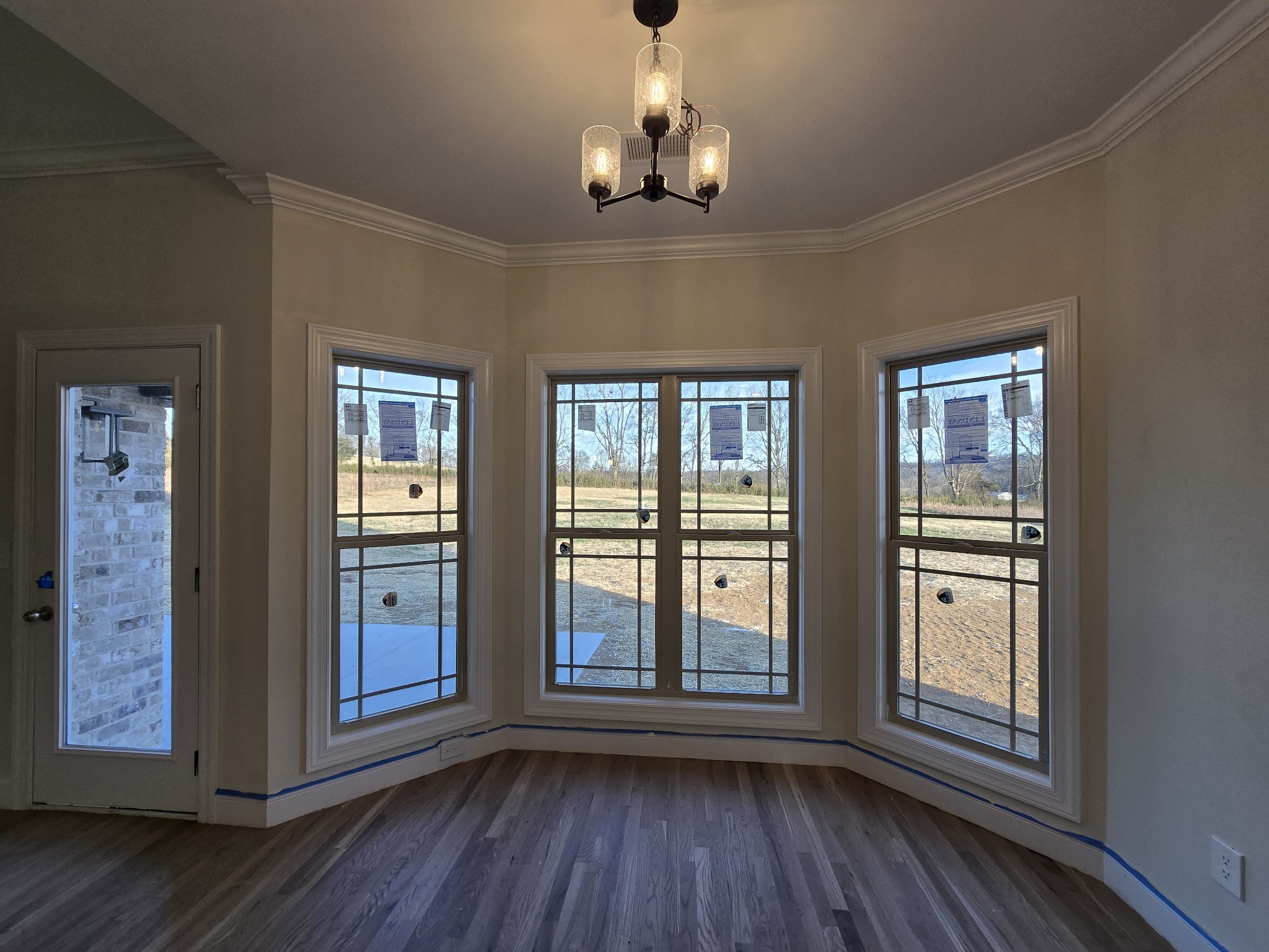 116 Dandelion Lane Beechgrove, TN 37018 - Photo 12 of 31 a view of a livingroom with wooden floor and windows