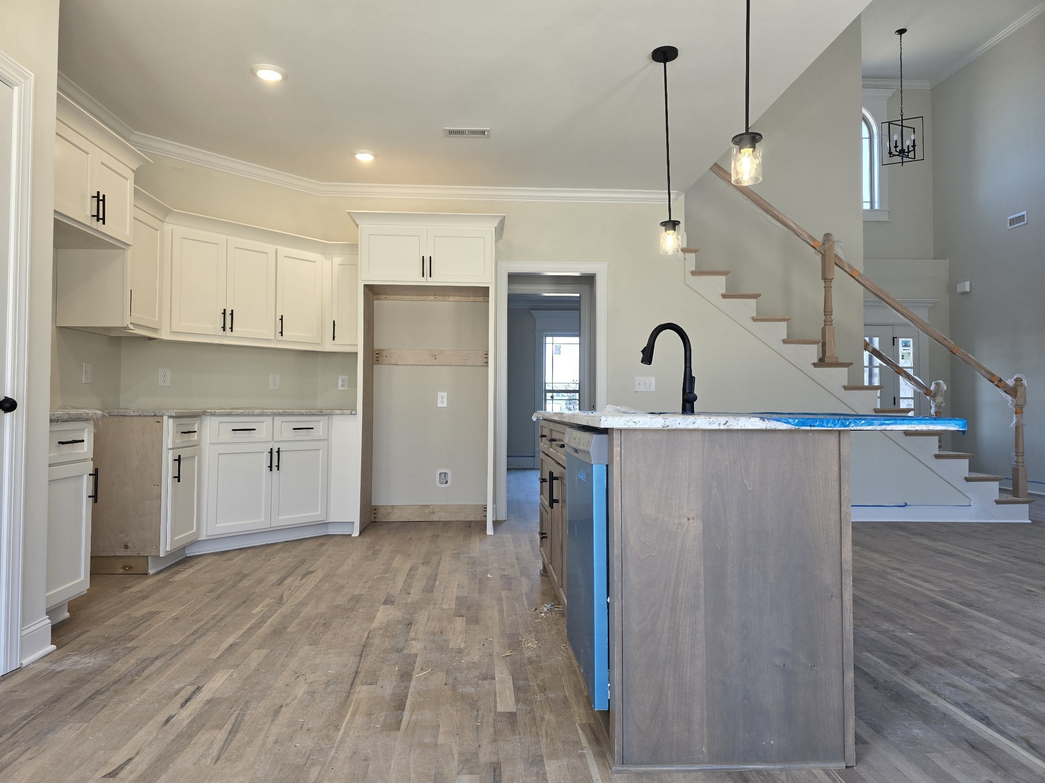116 Dandelion Lane Beechgrove, TN 37018 - Photo 13 of 31 a kitchen with kitchen island granite countertop a stove a sink a refrigerator and a wooden floor