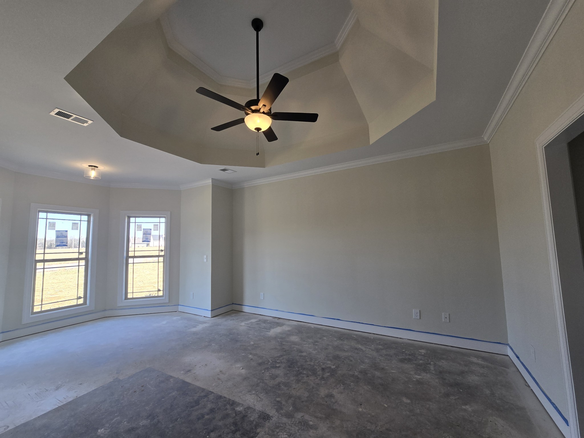 116 Dandelion Lane Beechgrove, TN 37018 - Photo 17 of 31 an empty room with chandelier fan and windows