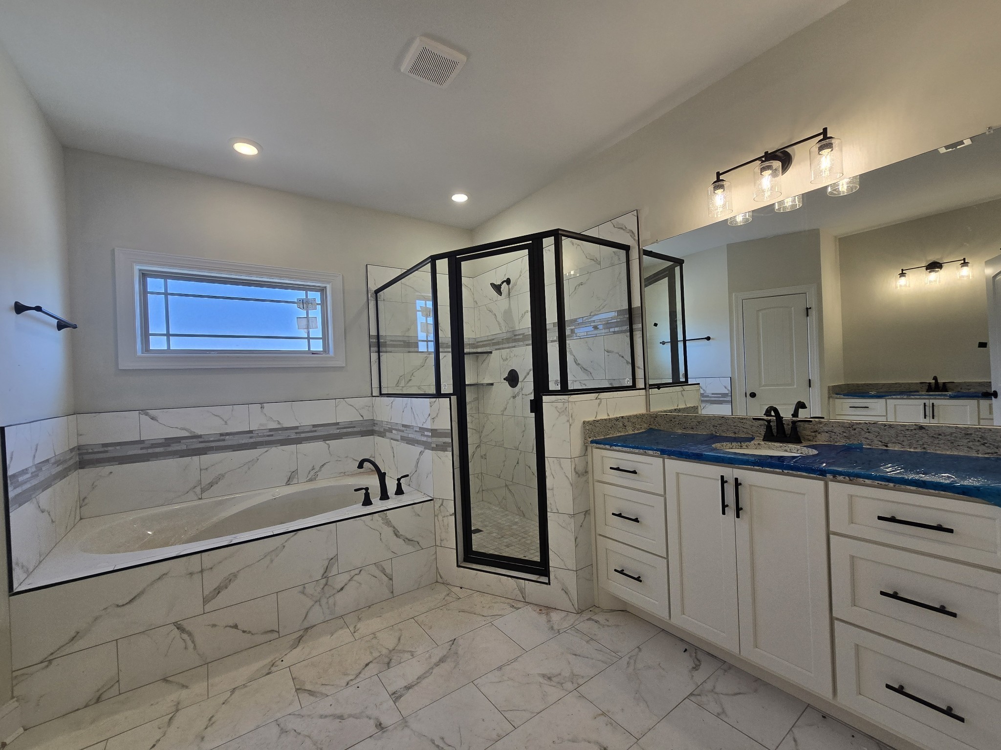 116 Dandelion Lane Beechgrove, TN 37018 - Photo 21 of 31 a spacious bathroom with a granite countertop sink mirror bathtub and shower