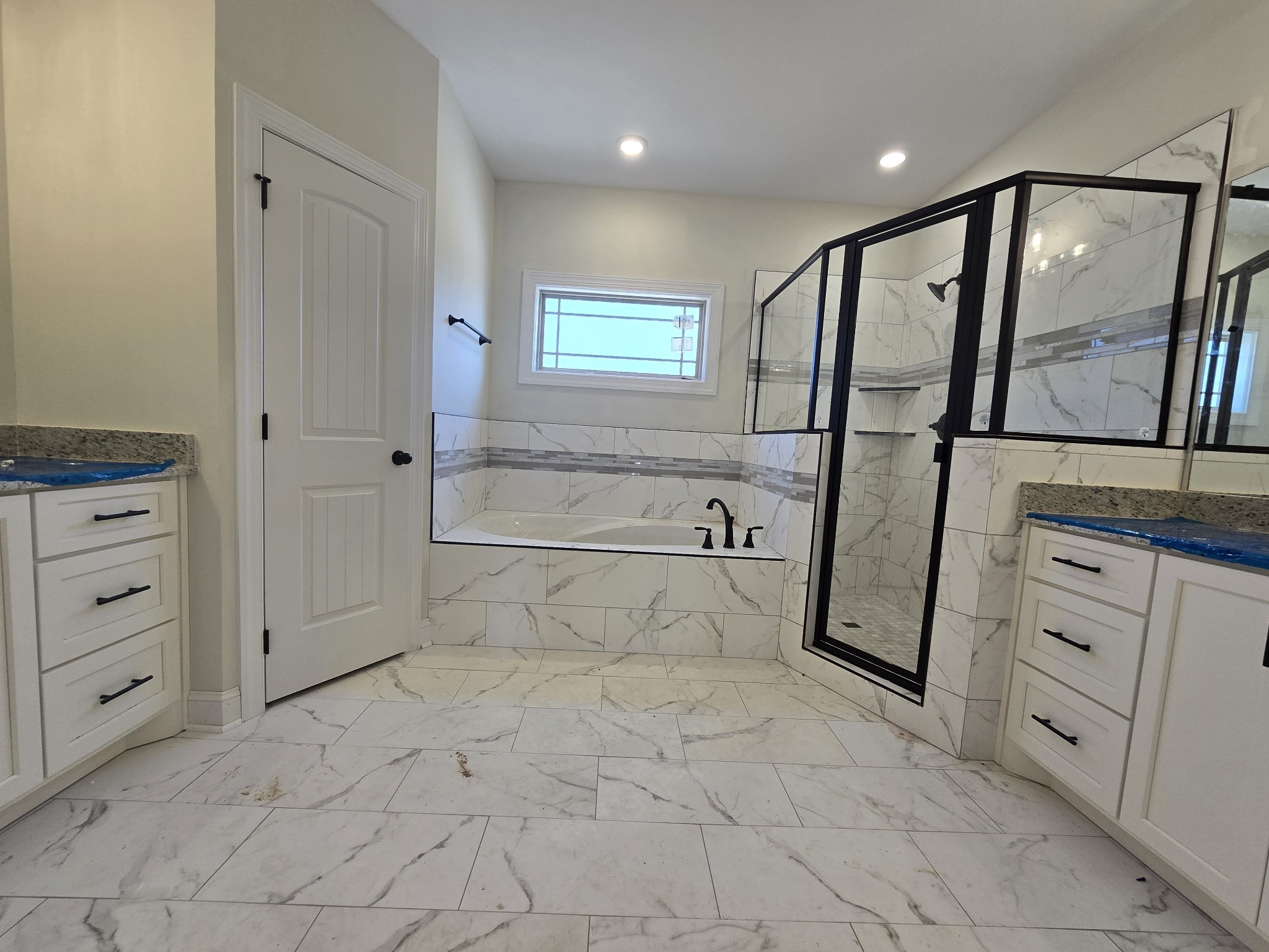 116 Dandelion Lane Beechgrove, TN 37018 - Photo 22 of 31 a bathroom with a granite countertop sink a vanity and a shower