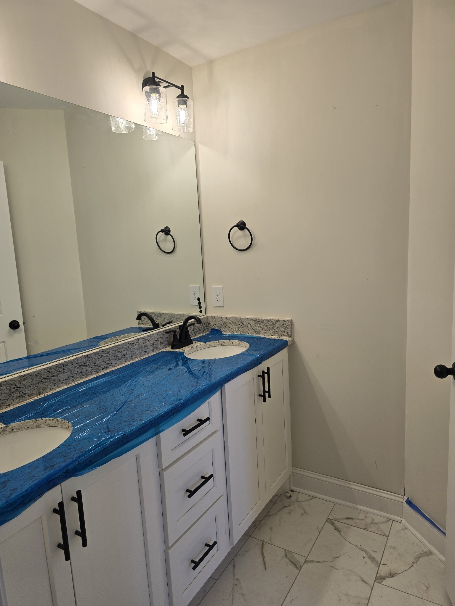 116 Dandelion Lane Beechgrove, TN 37018 - Photo 31 of 31 a bathroom with a double vanity sink and mirror