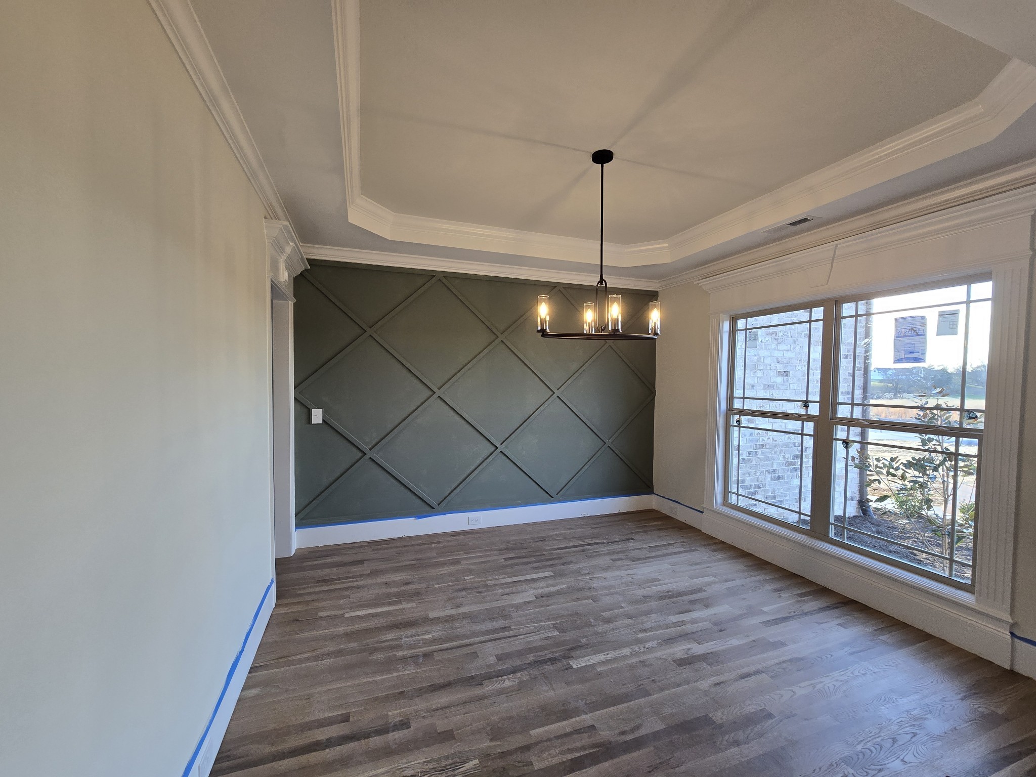 116 Dandelion Lane Beechgrove, TN 37018 - Photo 9 of 31 a view of an empty room with wooden floor and a window