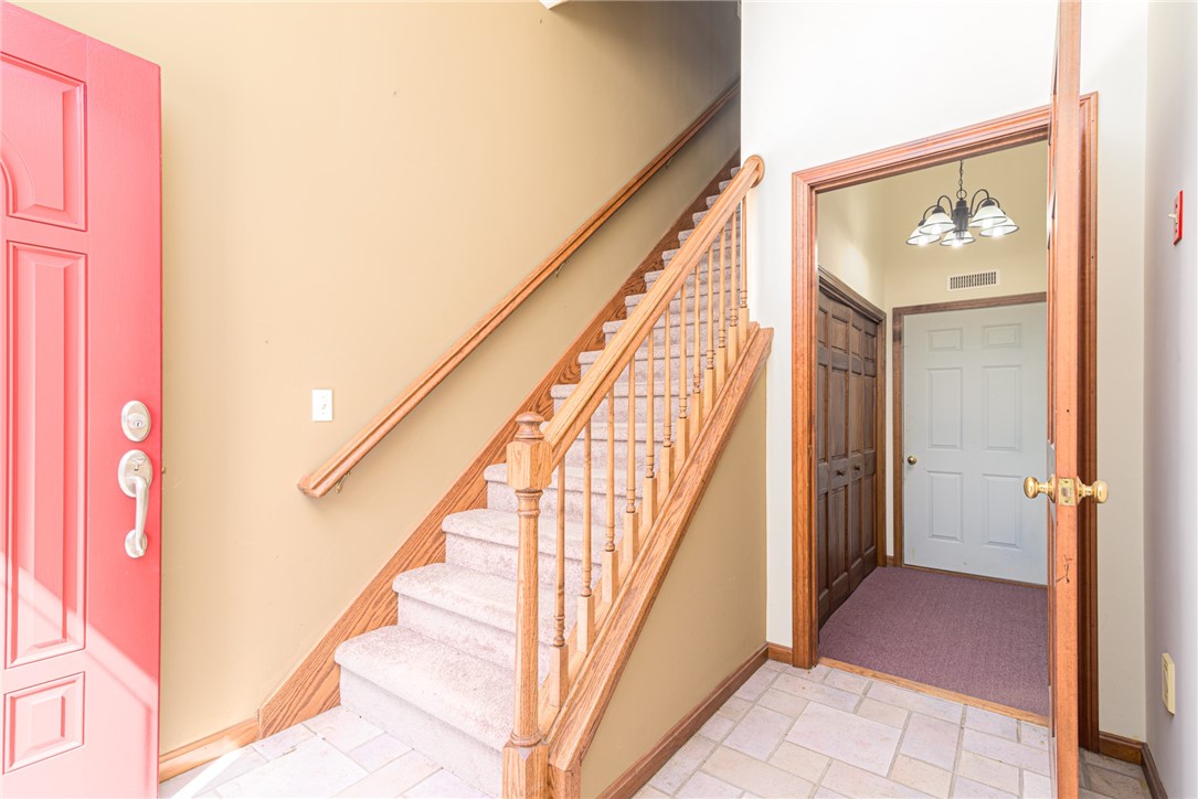 31 Kingfisher Road South Kingstown, RI 02879 - Photo 15 of 24 Stairs to living area. Utility room, washer/dryer area and access to garage from entry level