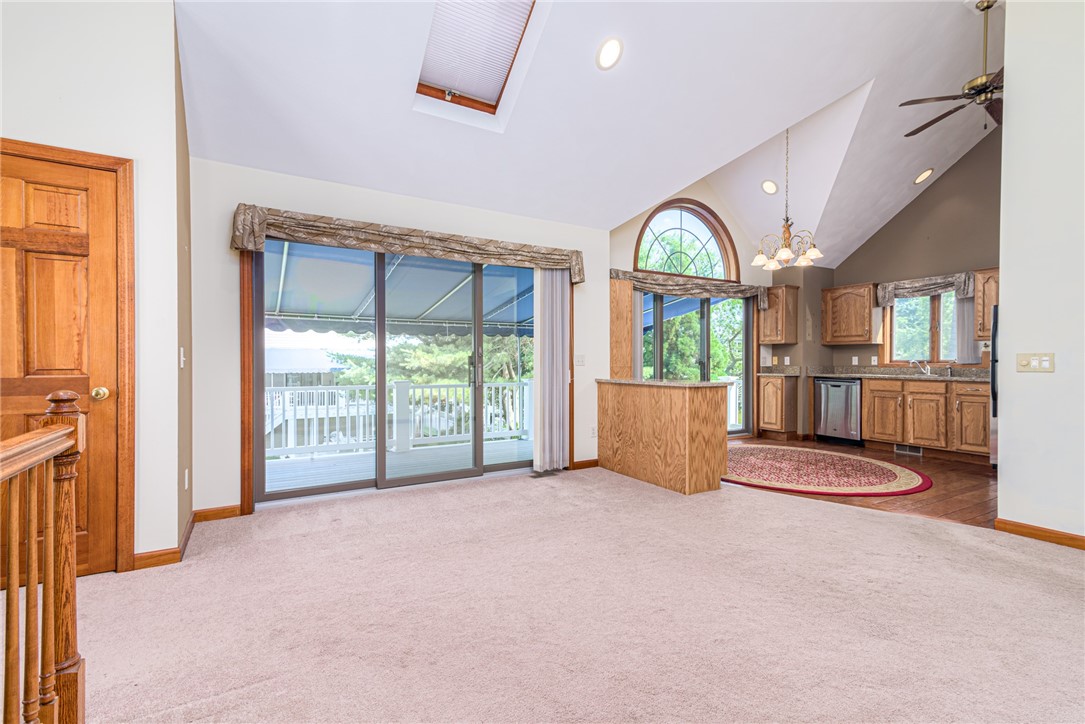 31 Kingfisher Road South Kingstown, RI 02879 - Photo 4 of 24 Sliders to large deck which runs the length of the home