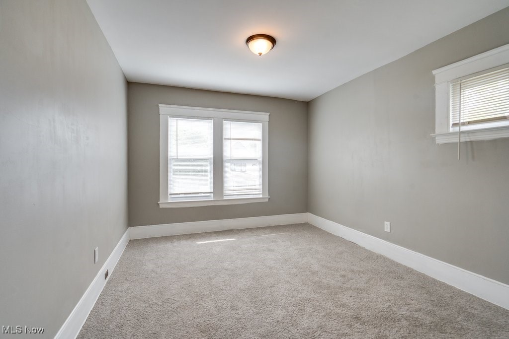 1261 Rozelle Avenue Cleveland, OH 44112 - Photo 23 of 32 Carpeted spare room featuring plenty of natural light