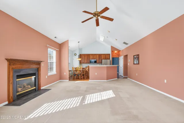 a view of a livingroom with furniture and a fireplace