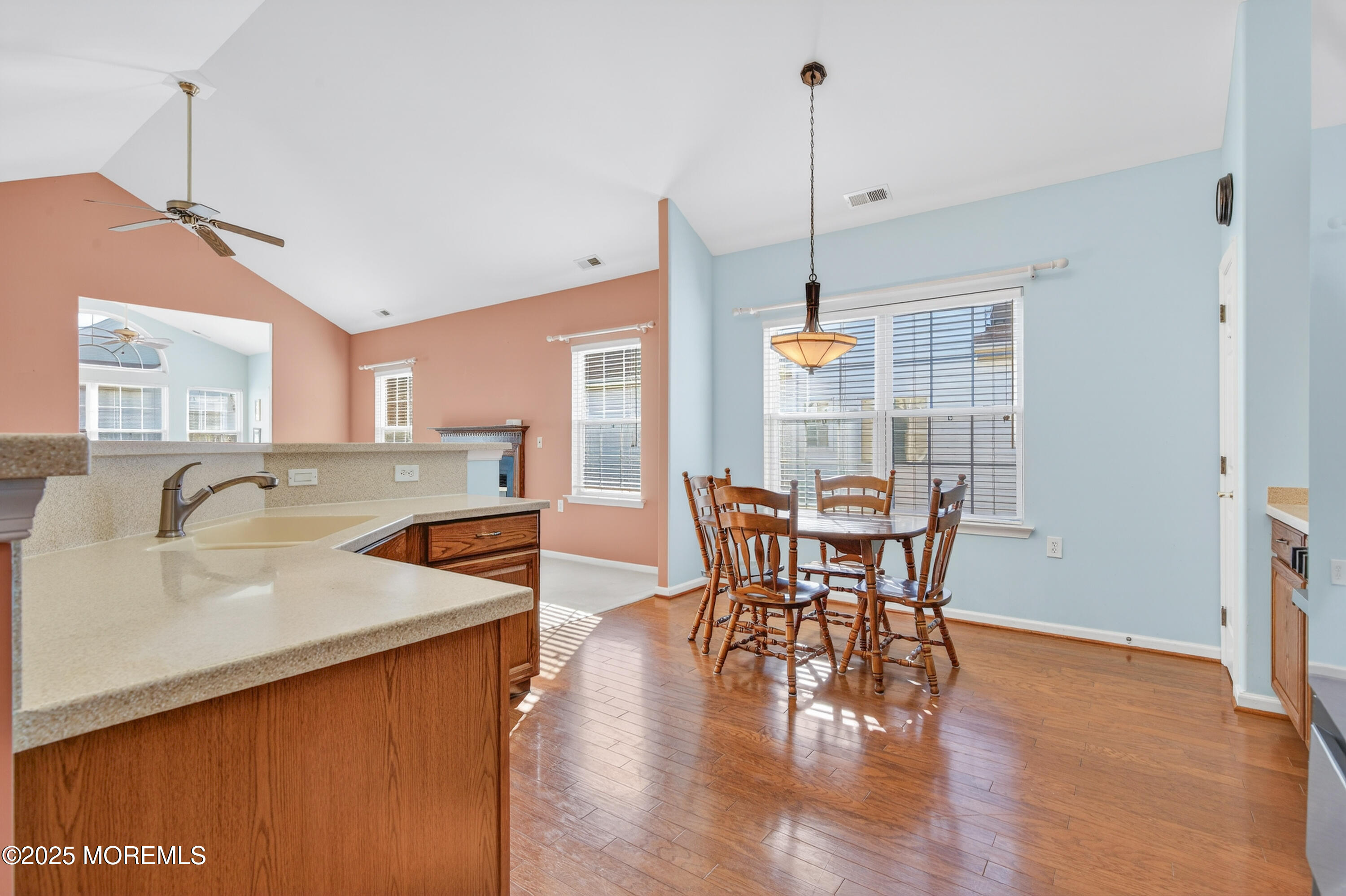 11 Drayton Road Manchester Township, NJ 08759 - Photo 9 of 39 a view of a dining room and livingroom with furniture wooden floor a chandelier