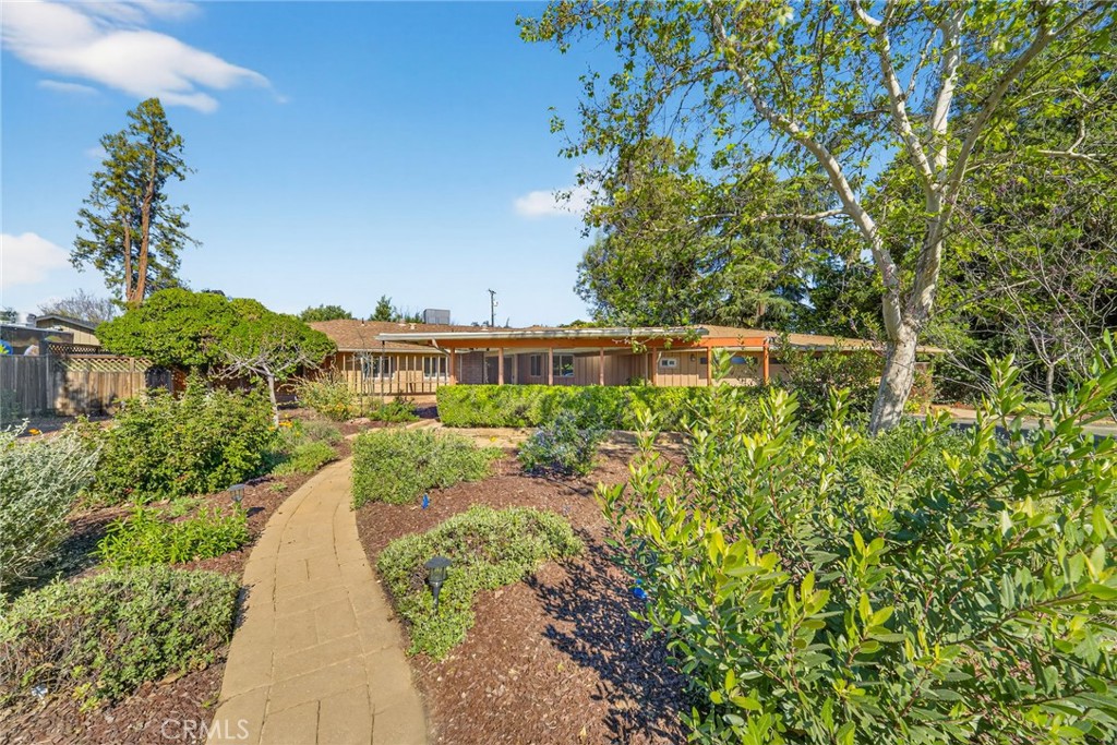 4872 N Arcade Fresno, CA 93704 - Photo 2 of 75 a view of a garden with a building in the background