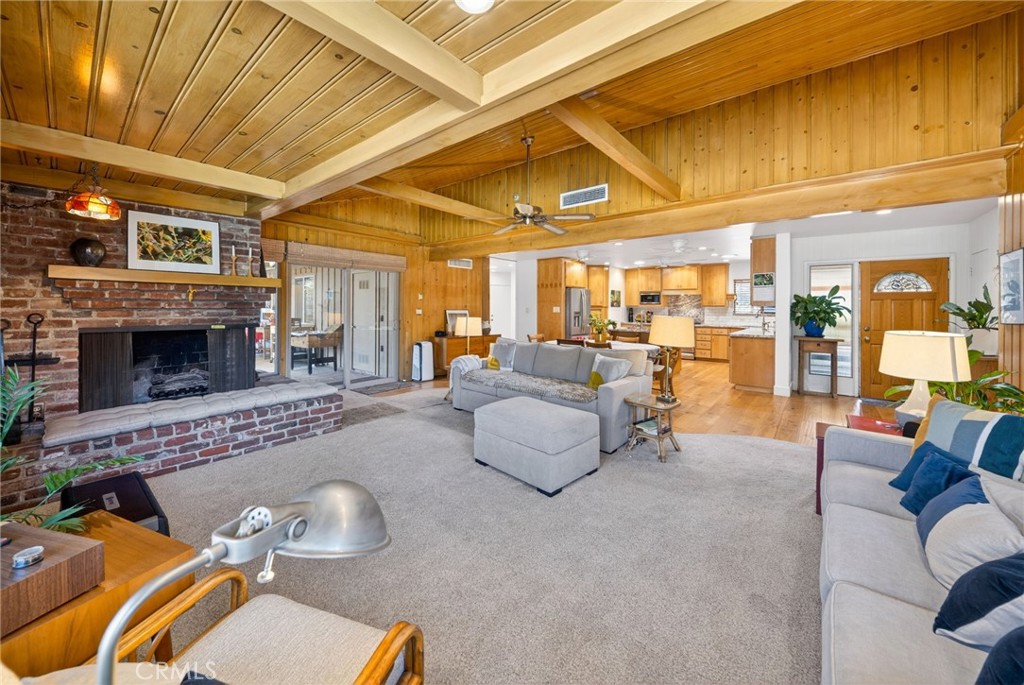 4872 N Arcade Fresno, CA 93704 - Photo 21 of 75 a living room with furniture and a fireplace