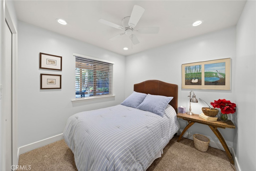 4872 N Arcade Fresno, CA 93704 - Photo 28 of 75 a bedroom with a bed and a painting on the wall